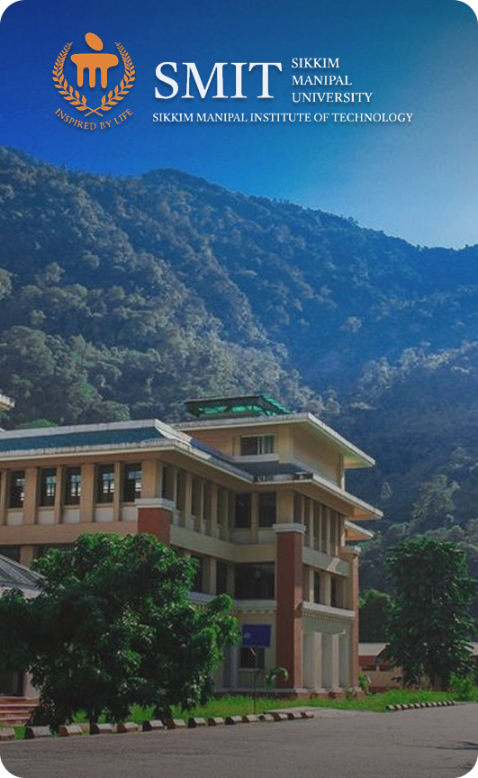 SMIT Sikkim Manipal Institute of Technology campus building with mountains in the background under a clear blue sky